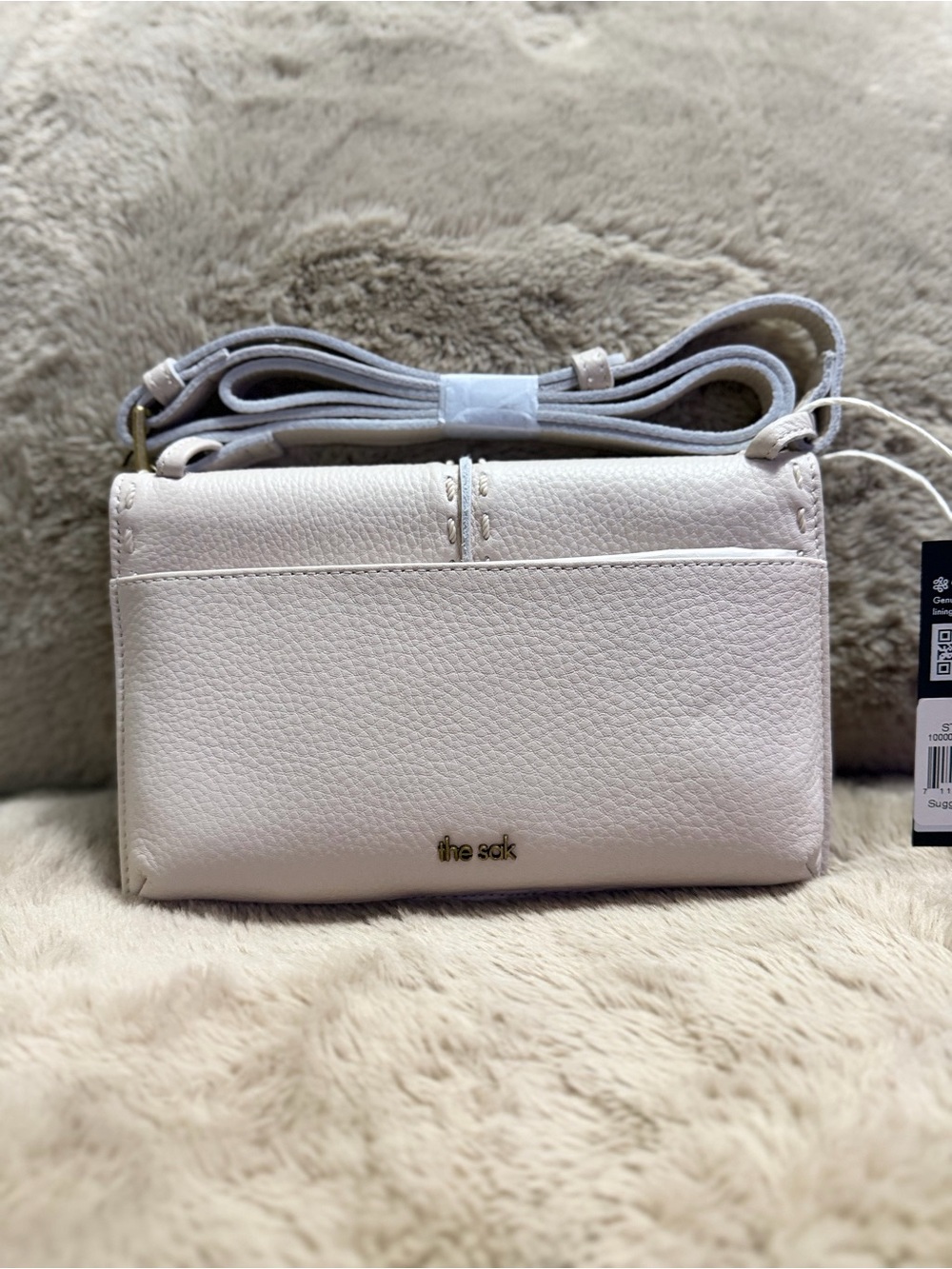 The Sak Pebble Leather Crossbody Bag in Pale Pink
